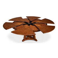 Walnut Jupe dining table with open segments and star pattern.