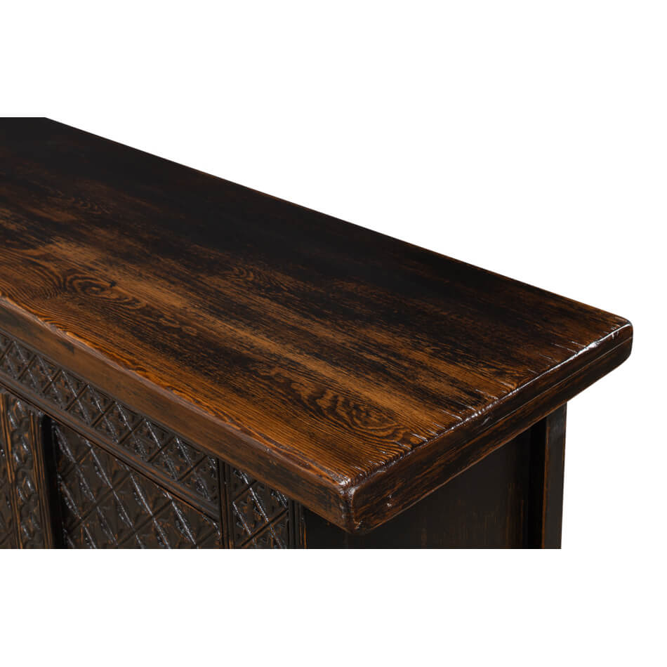 Close-up of rustic sideboard top surface.