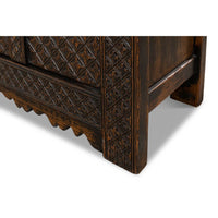 Close-up of decorative sideboard leg detailing.