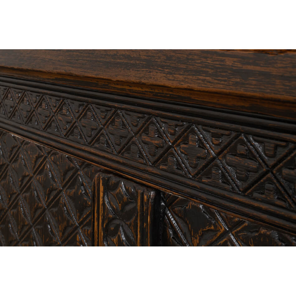 Intricate carving details on Moroccan sideboard panel.