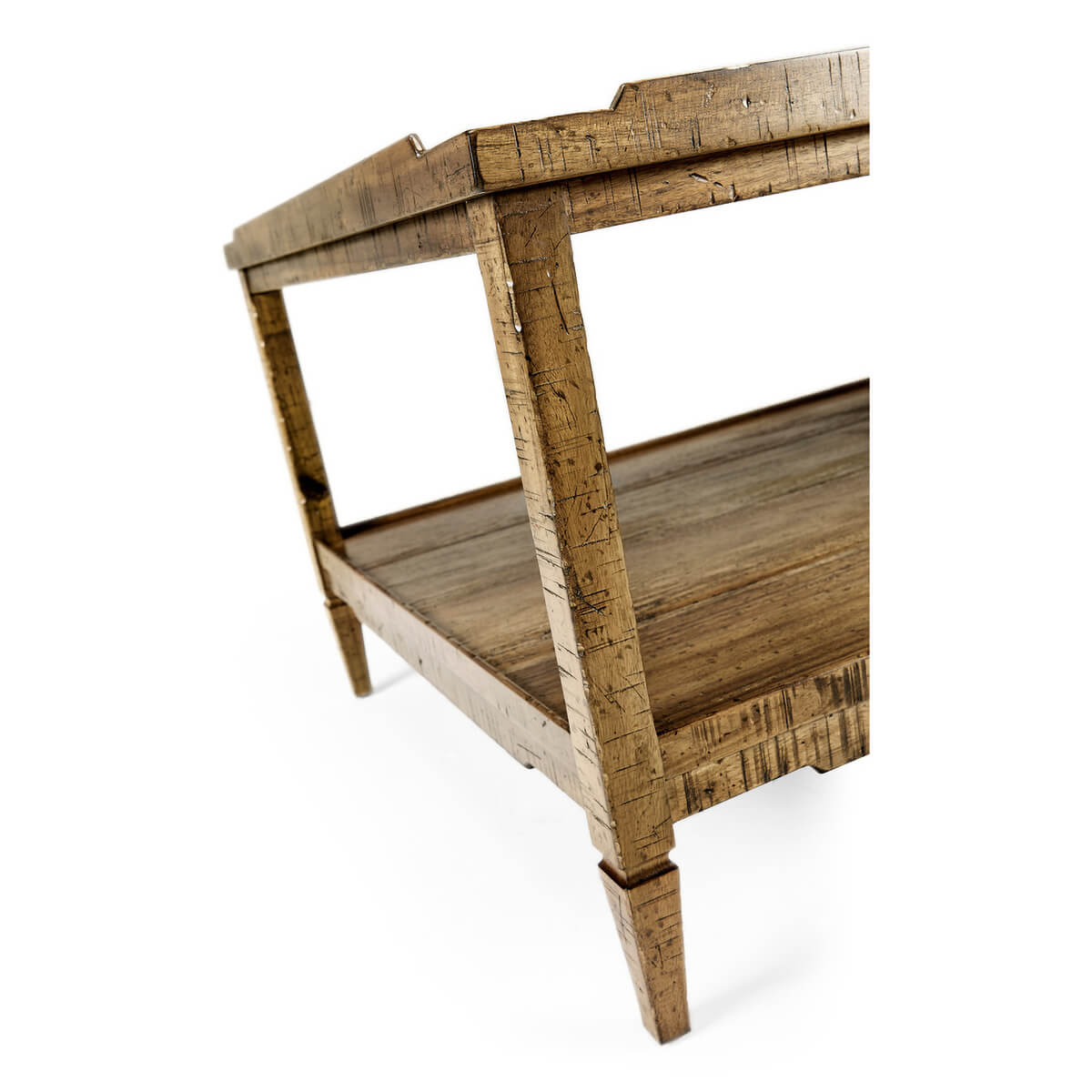 Rustic coffee table corner detail with tapered legs.