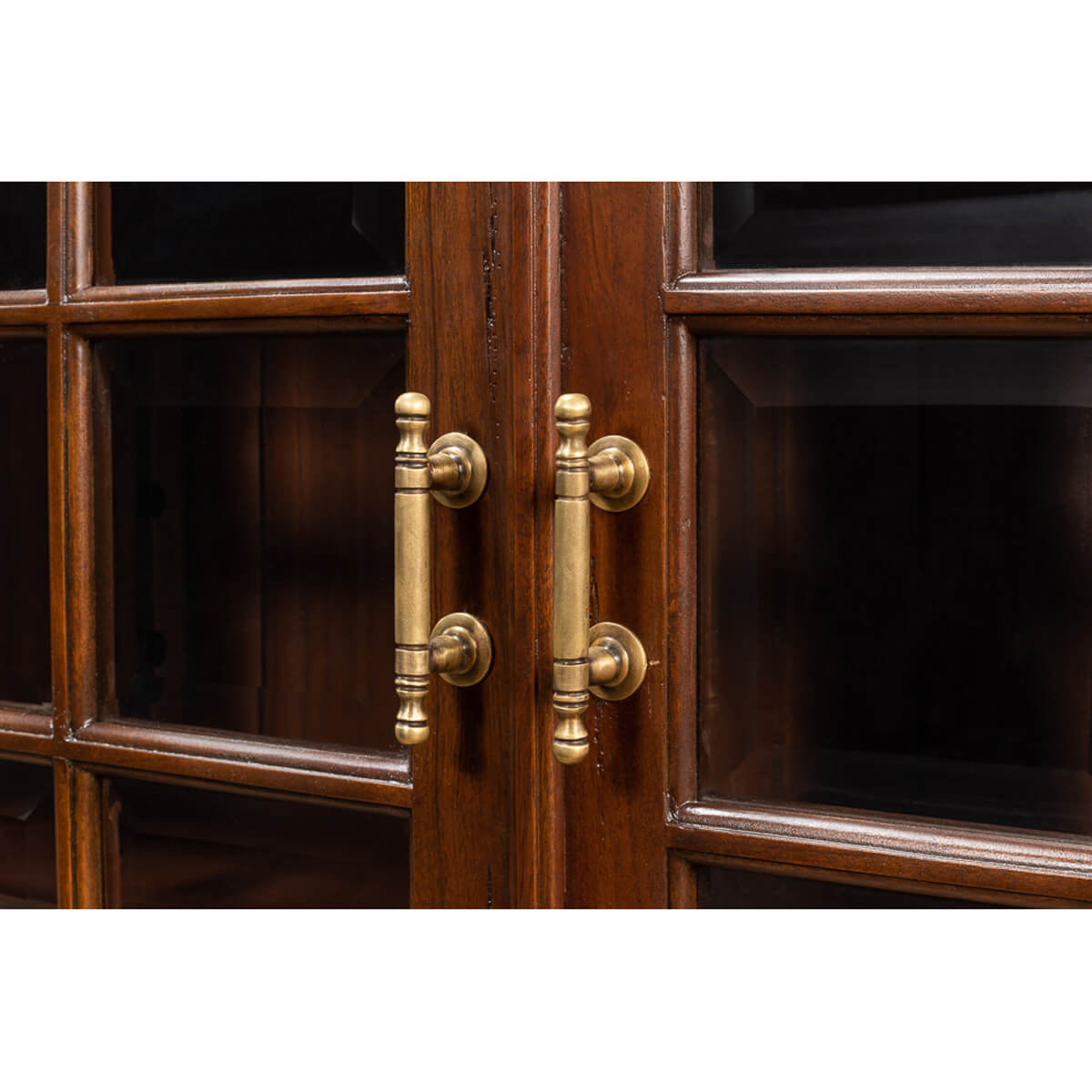 Close-up of handles on rustic walnut bookcase.