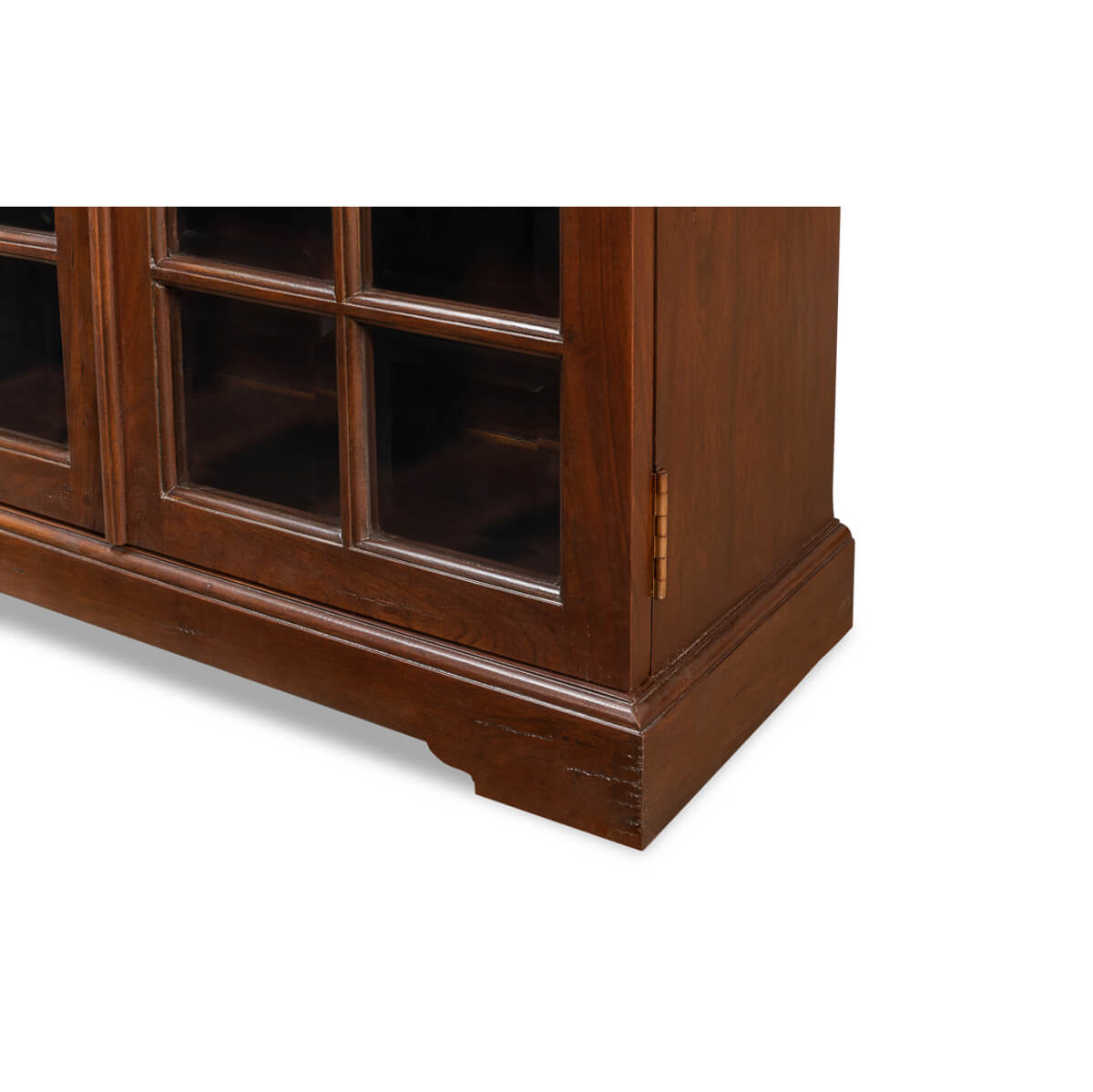 Lower corner detail of rustic walnut bookcase.