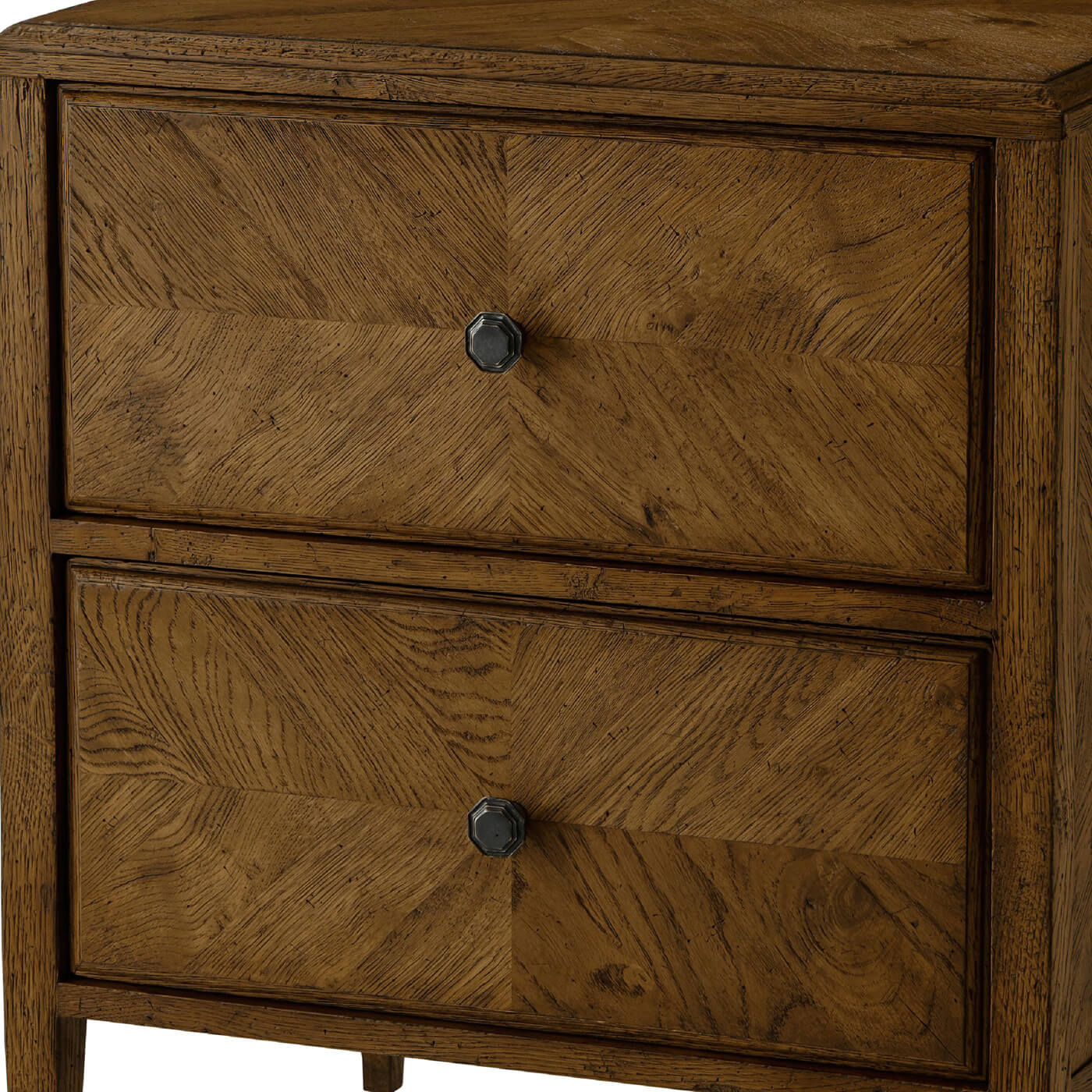Close-up of nightstand drawers, dark oak texture visible.