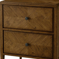 Close-up of nightstand drawers, dark oak texture visible.