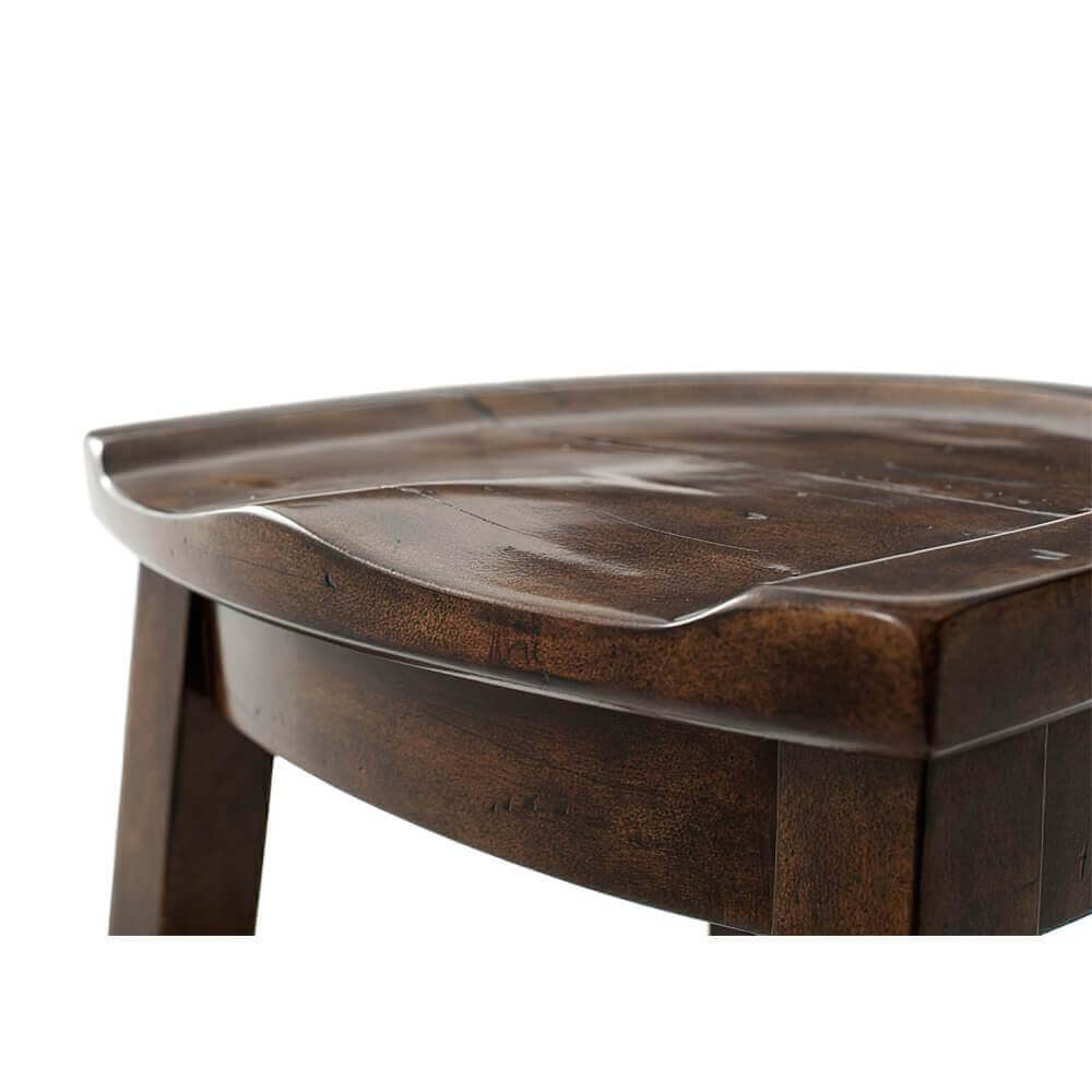 Close-up of Rustic Counter Stool, textured wooden seat.