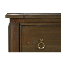 Corner detail of rustic chest of drawers, close-up.
