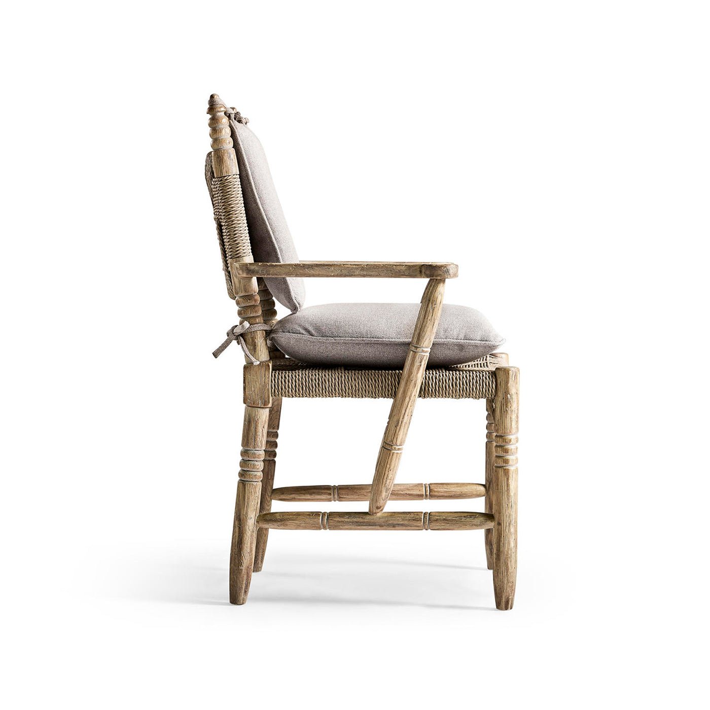 Rustic armchair side view with cushions.