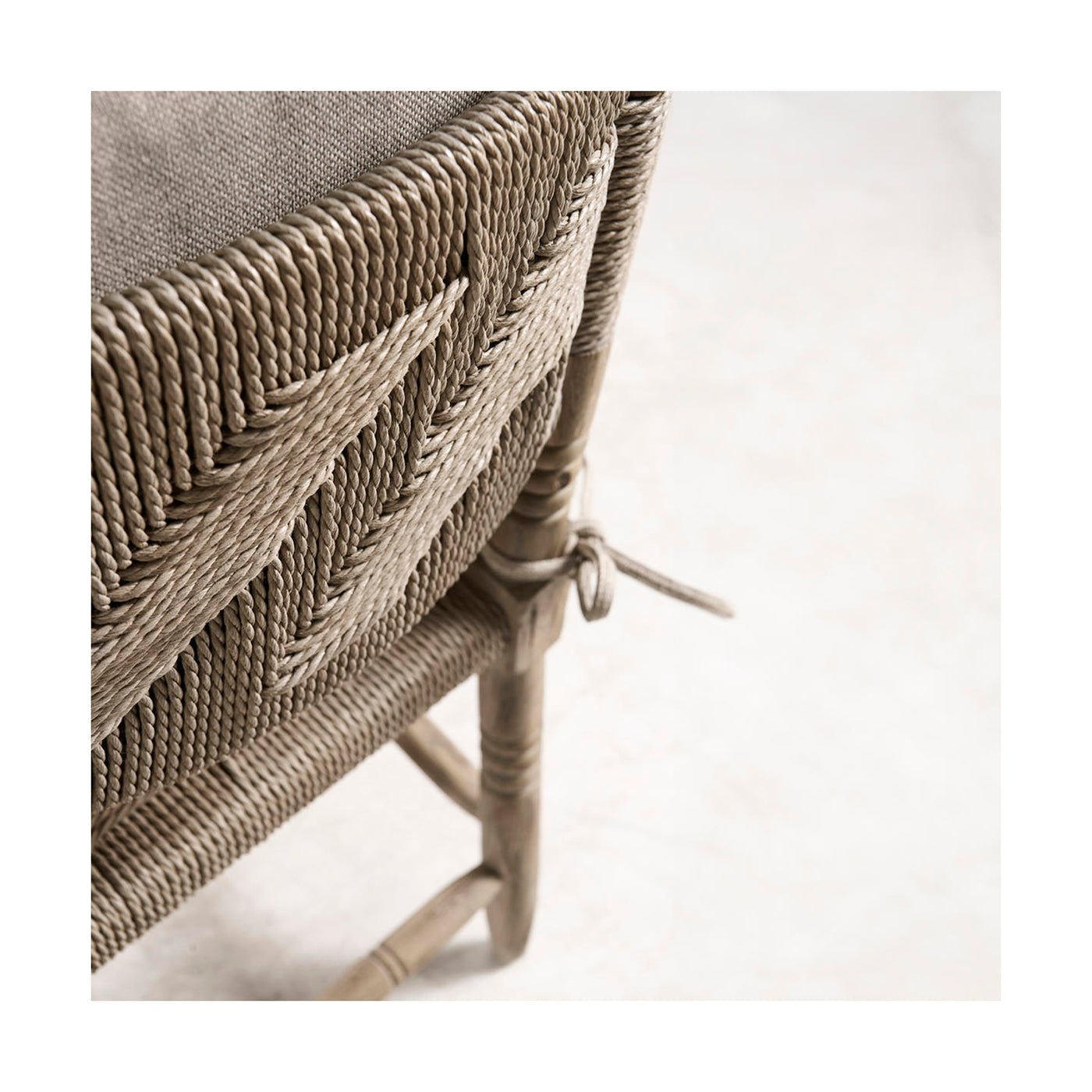 Close-up of rustic armchair woven details.