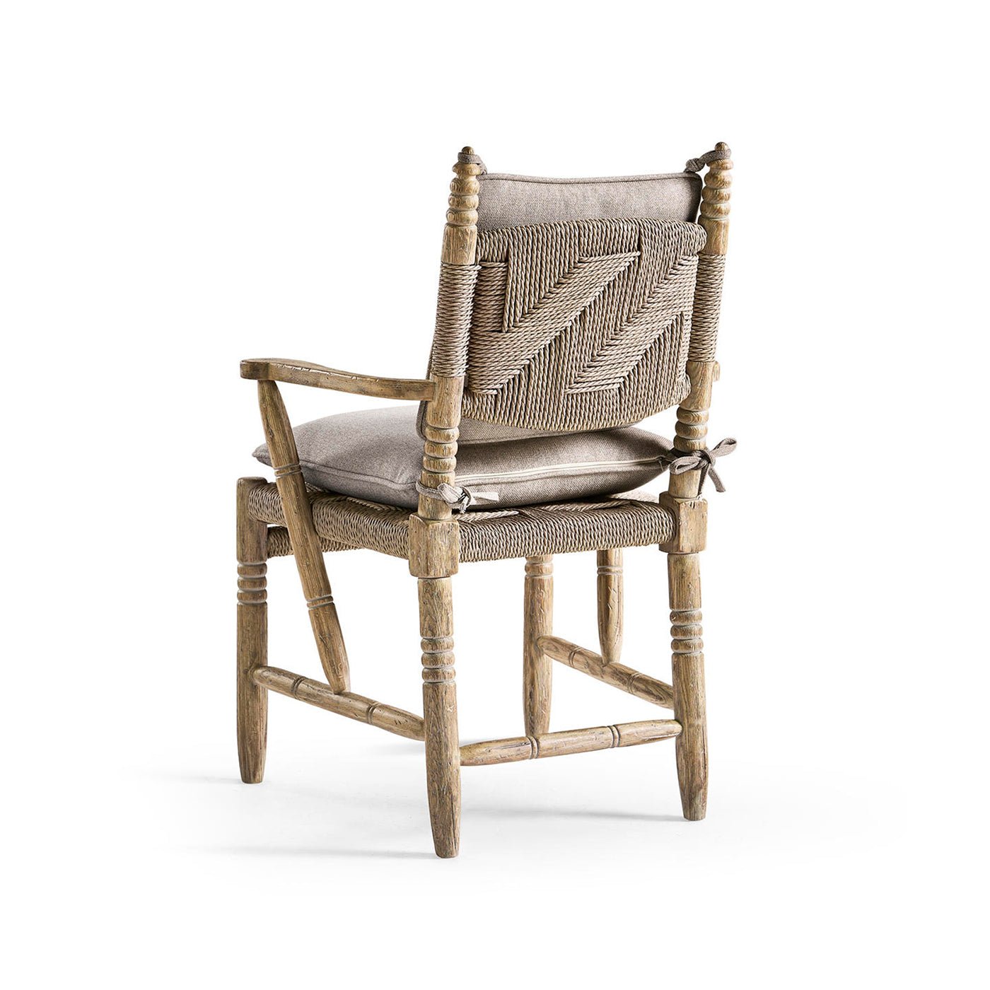 Rustic armchair back view with cushions.