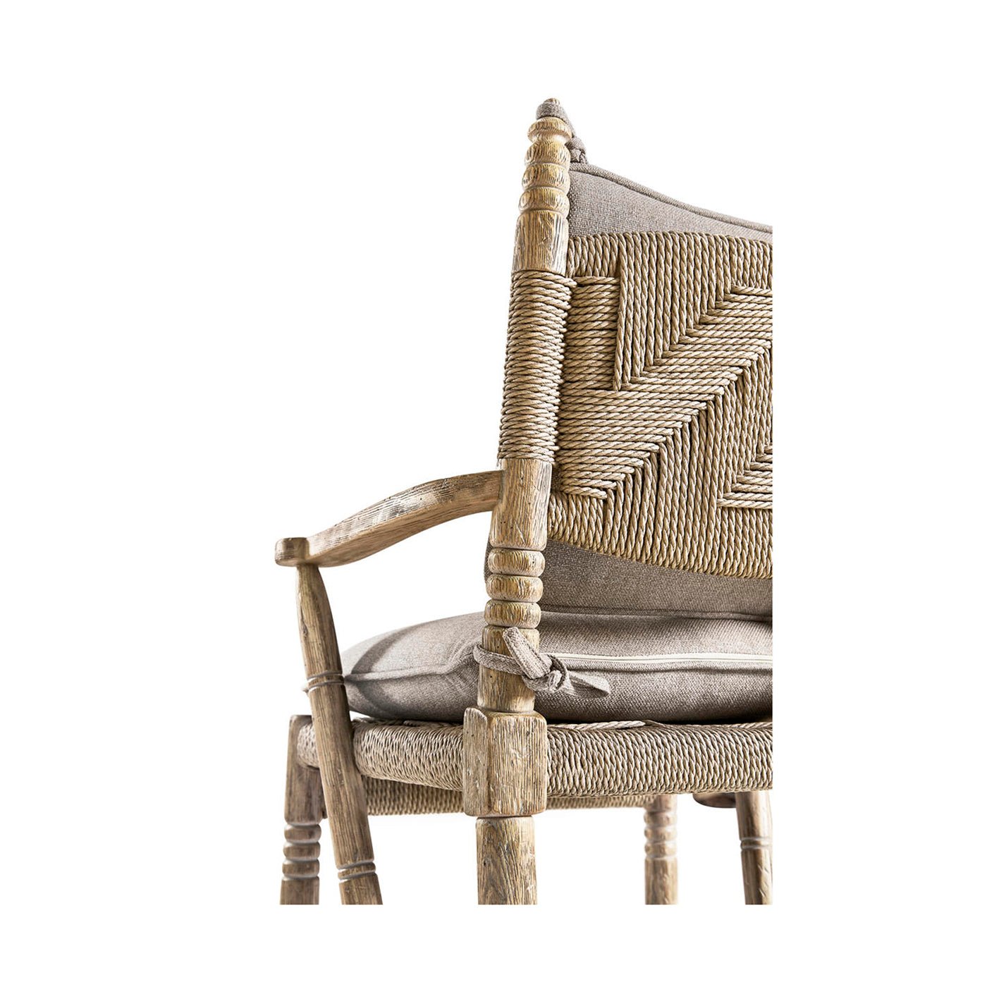Close-up of rustic armchair's backrest and cushion.