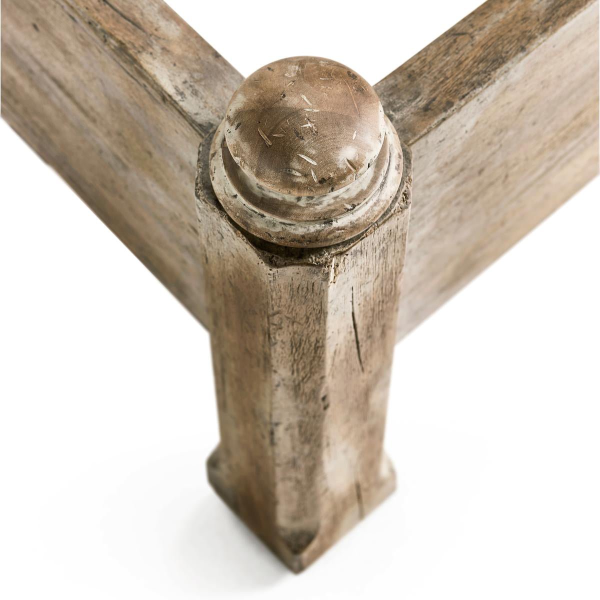 Close-up of rustic bed corner joint detail.