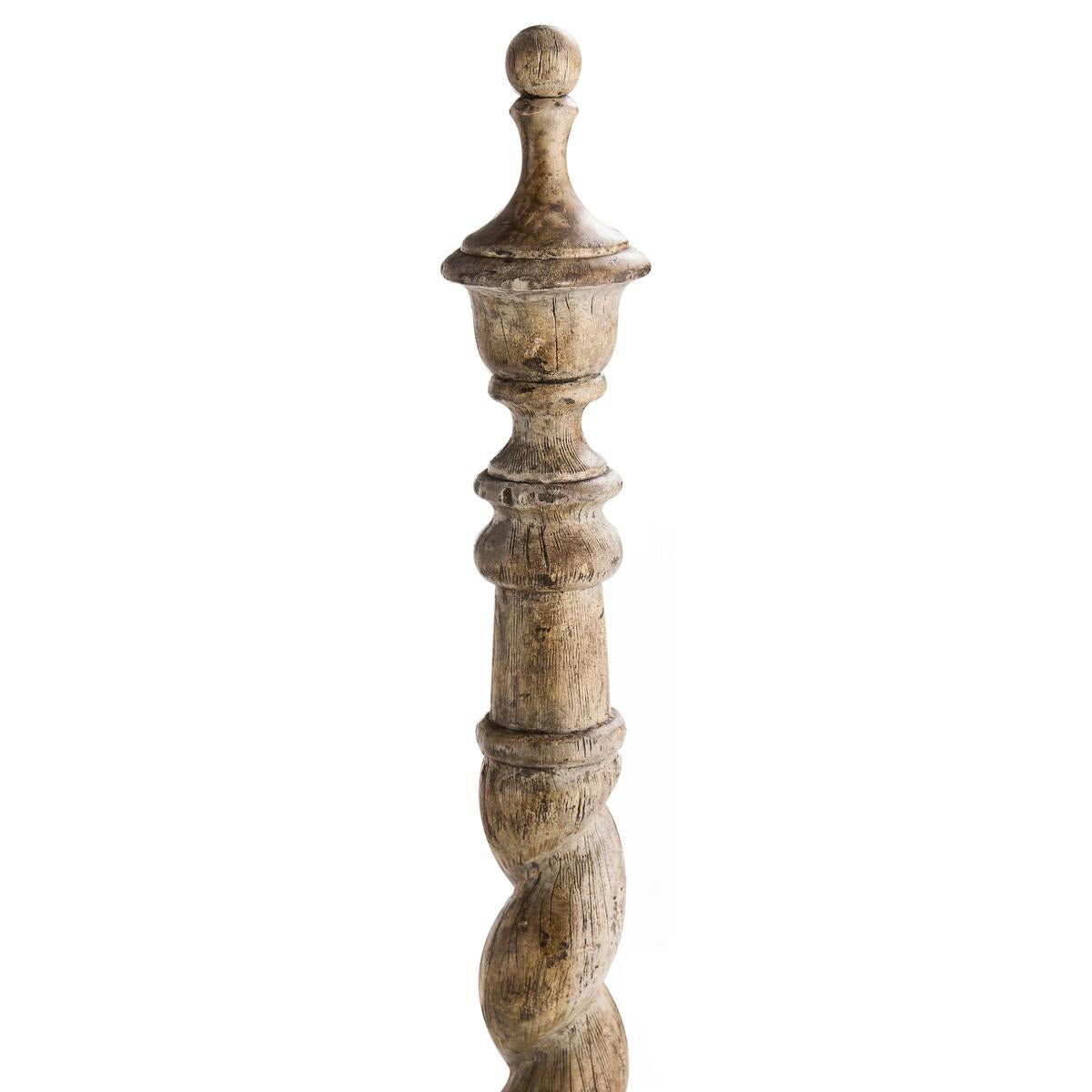 Detailed view of spiral post top on farmhouse bed.
