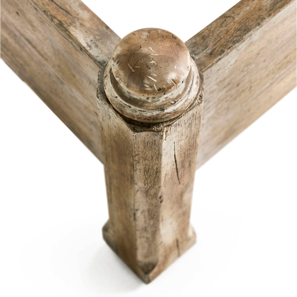 Rustic farmhouse bed, corner post texture close-up.