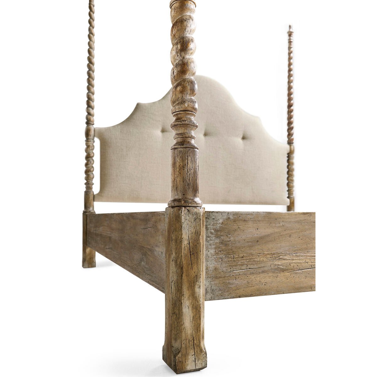 Rustic farmhouse bed, low angle showing post detail.