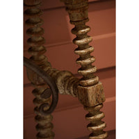 Close-up of twisted leg detailing on console table.