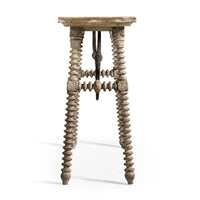 End view of console table showcasing intricate leg details.