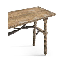 Rustic console table with decorative ironwork side detail.