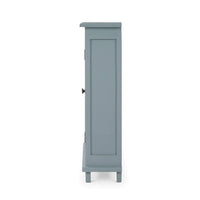 Side view of ocean blue farmhouse cabinet.