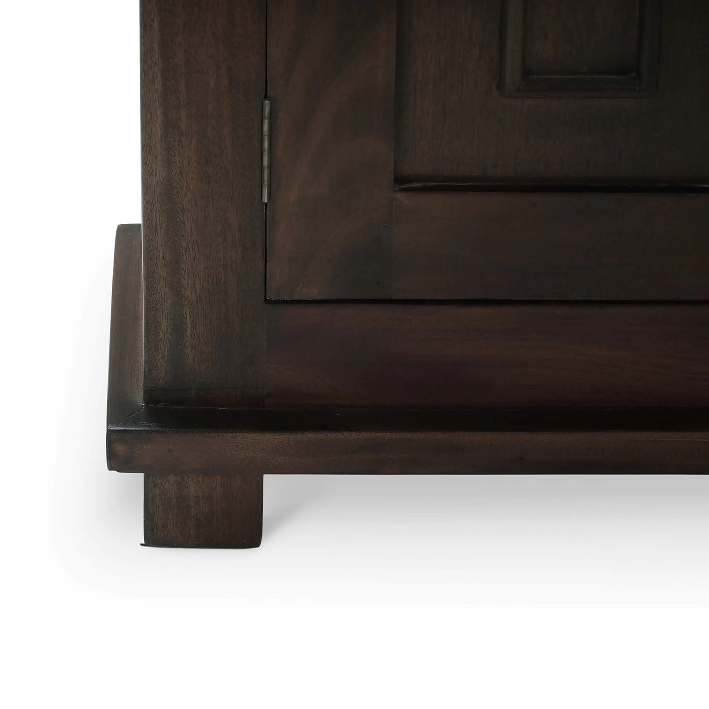 Close-up of cabinet base and feet, walnut finish.