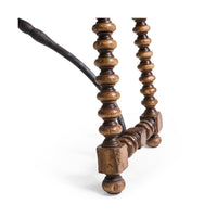 Close detail spool leg of farmhouse console table base.