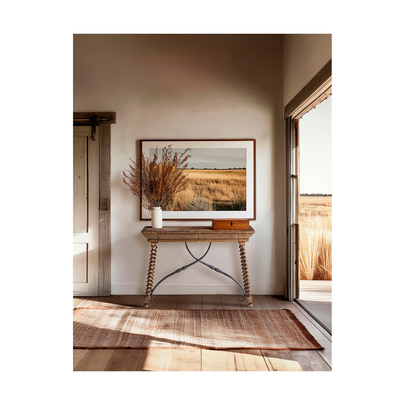 Farmhouse console table with decor, nature artwork, bright room.