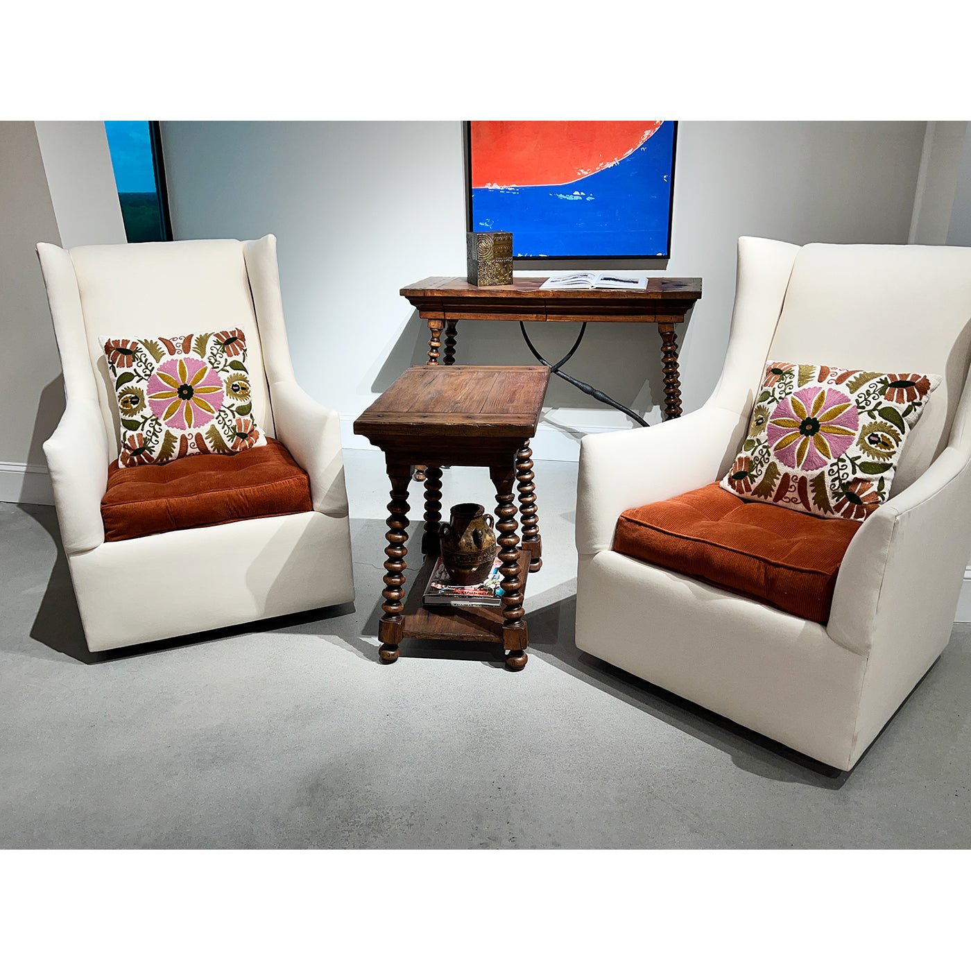 End table in living room setup with armchairs.
