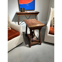 Front view of end table with surrounding decor.