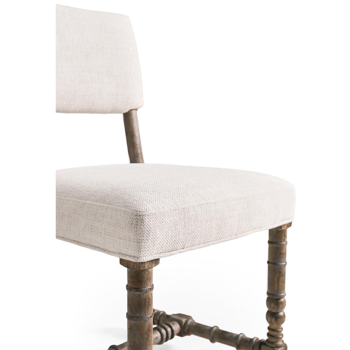 Close-up side seat fabric and wooden spool legs.