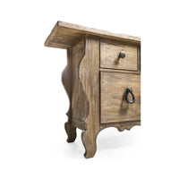 Decorative legs and lower section of rustic dresser.