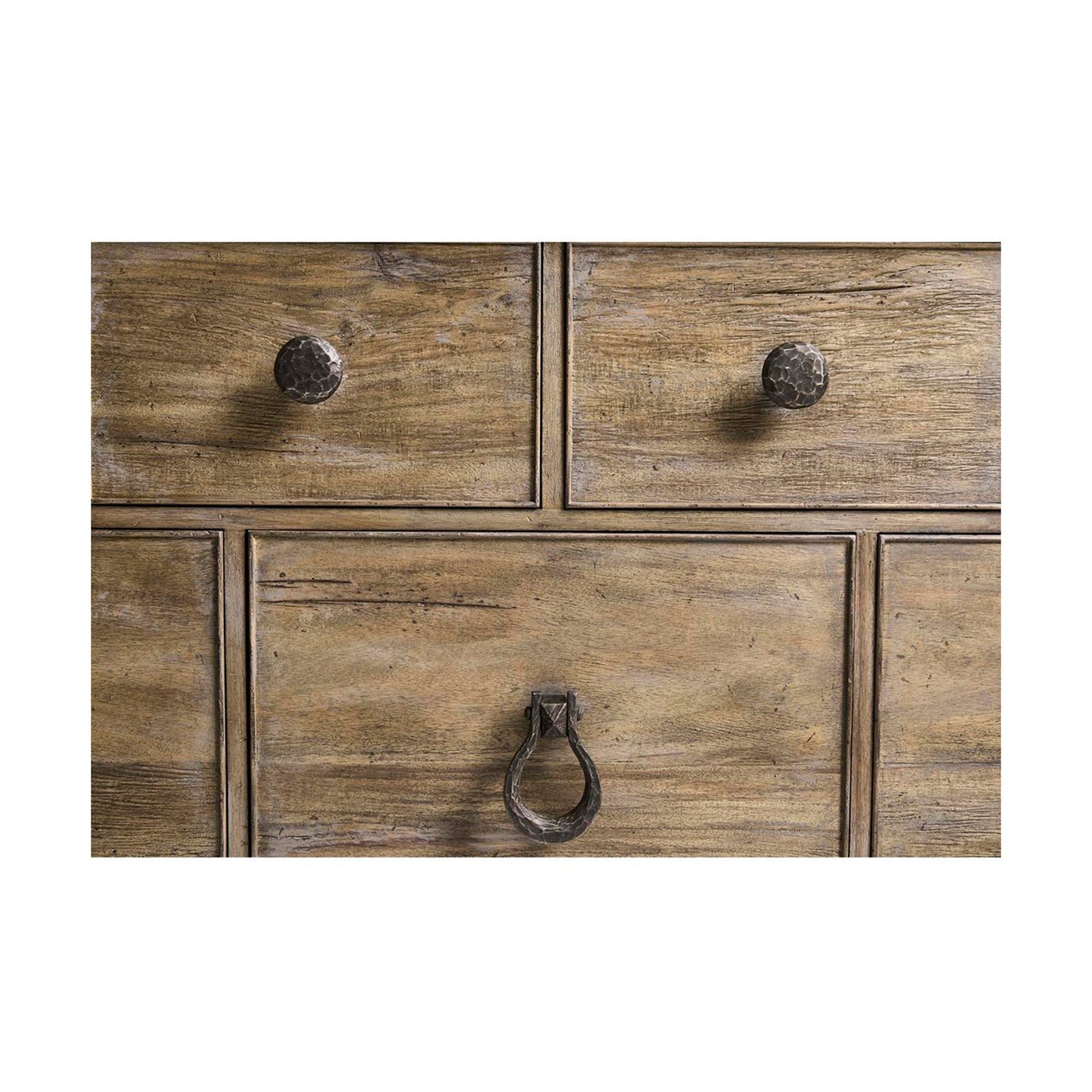 Detailed view of drawer knobs on farmhouse dresser.
