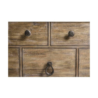 Detailed view of drawer knobs on farmhouse dresser.
