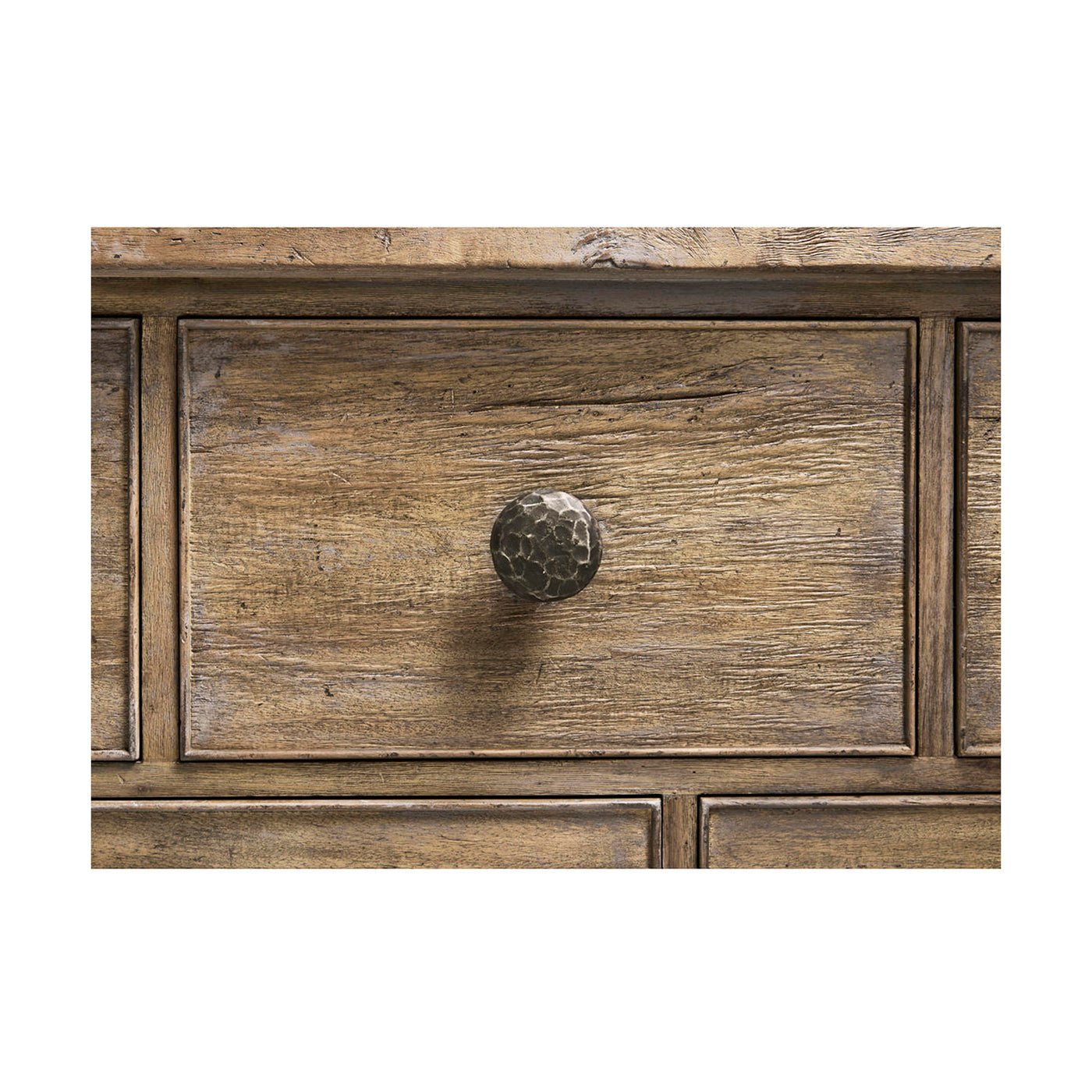Close-up of drawer knob on rustic dresser.