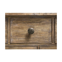 Close-up of drawer knob on rustic dresser.