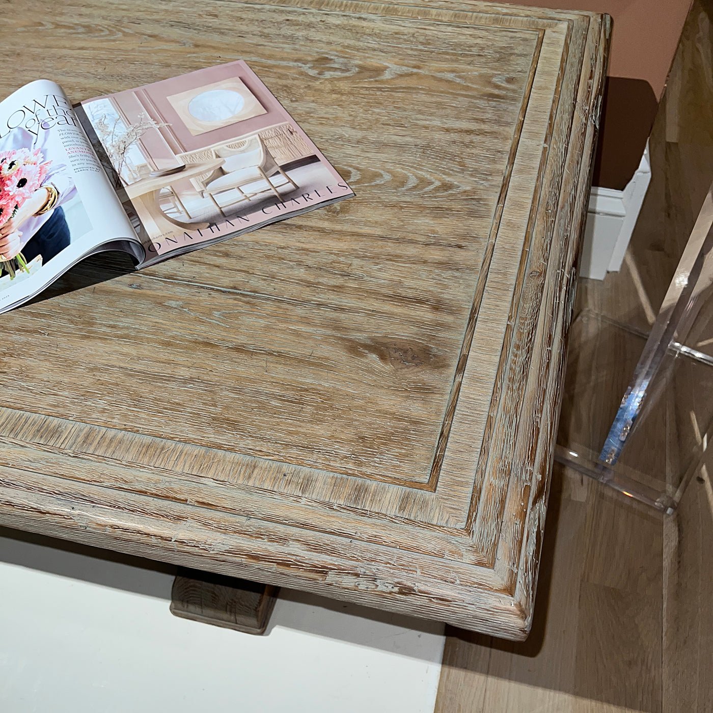Corner shot of rustic farmhouse table with magazine