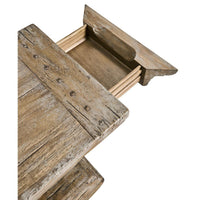 Close-up of open drawer in rustic wood side table.