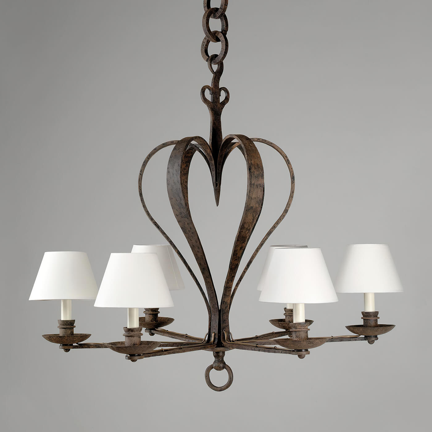 Close-up of chandelier's heart-shaped frame, elegant design.