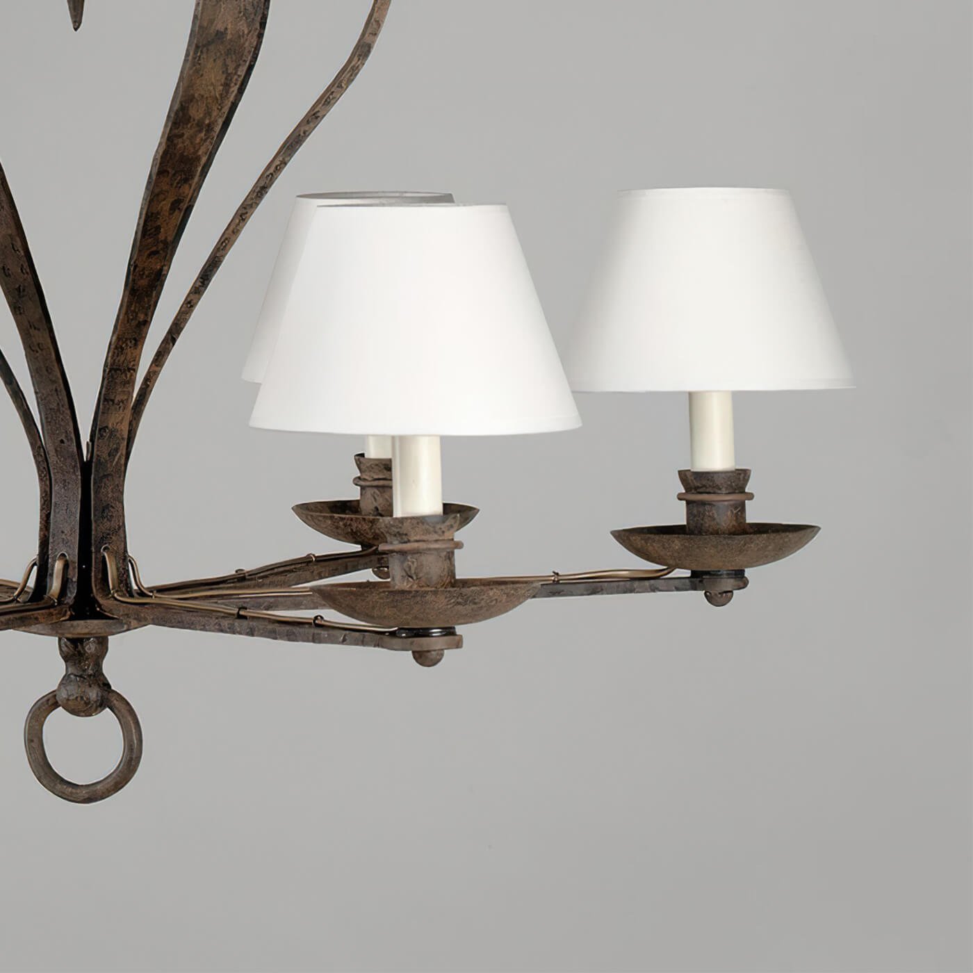 Side view of chandelier lights, rustic metal finish.