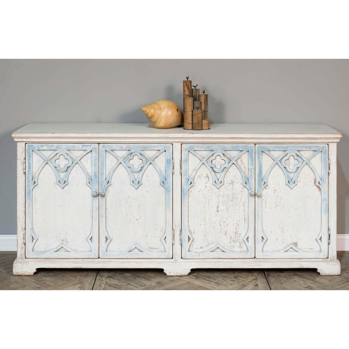 Rustic French Gothic cabinet, styled with decor items.