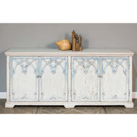 Rustic French Gothic cabinet, styled with decor items.