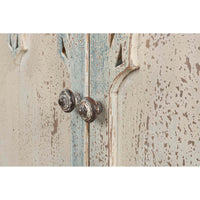 Rustic French Gothic cabinet, close-up of vintage door knobs.