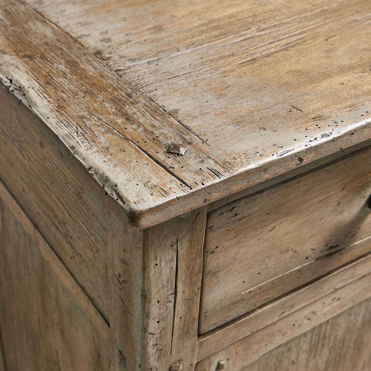 Close-up of sideboard's distressed wooden top.