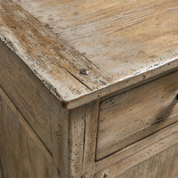 Close-up of sideboard's distressed wooden top.