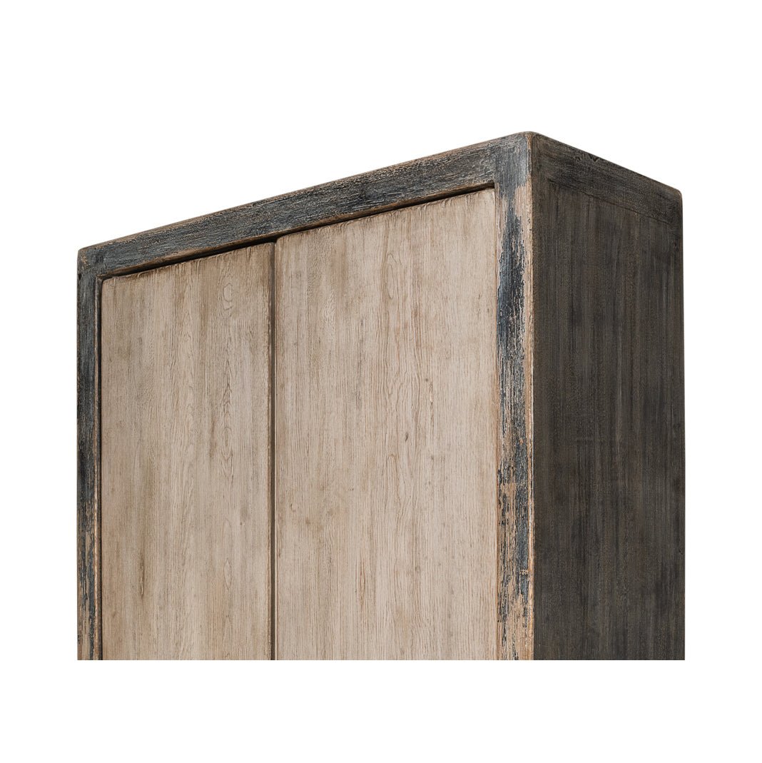 Rustic French tall cabinet, close-up top corner detail.