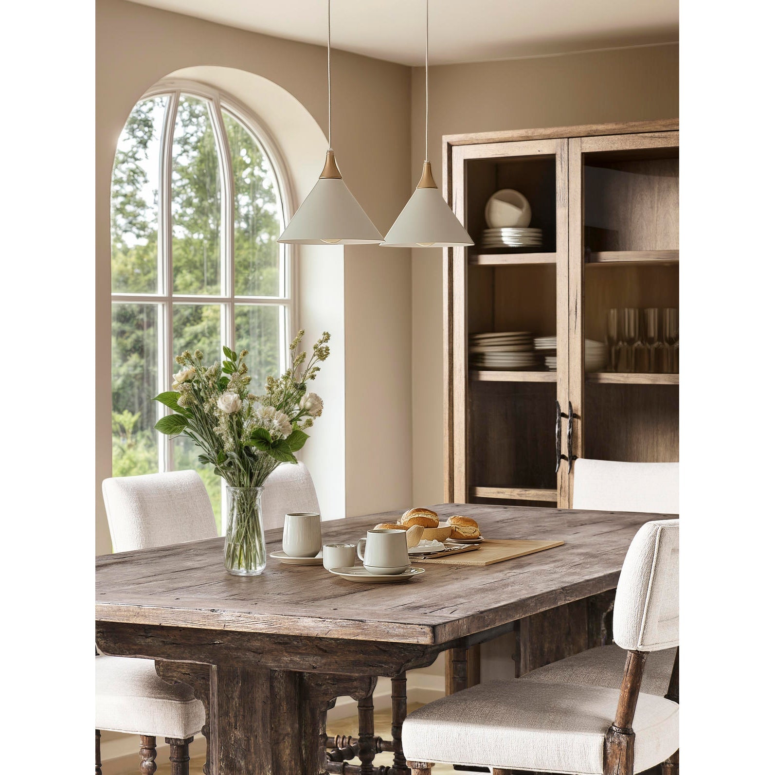 Rustic display cabinet in dining room setting with table.