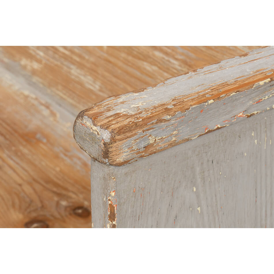 Rustic gray bench, close-up, detailed corner finish.