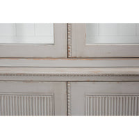 Close-up of middle section detail on rustic grey bookcase