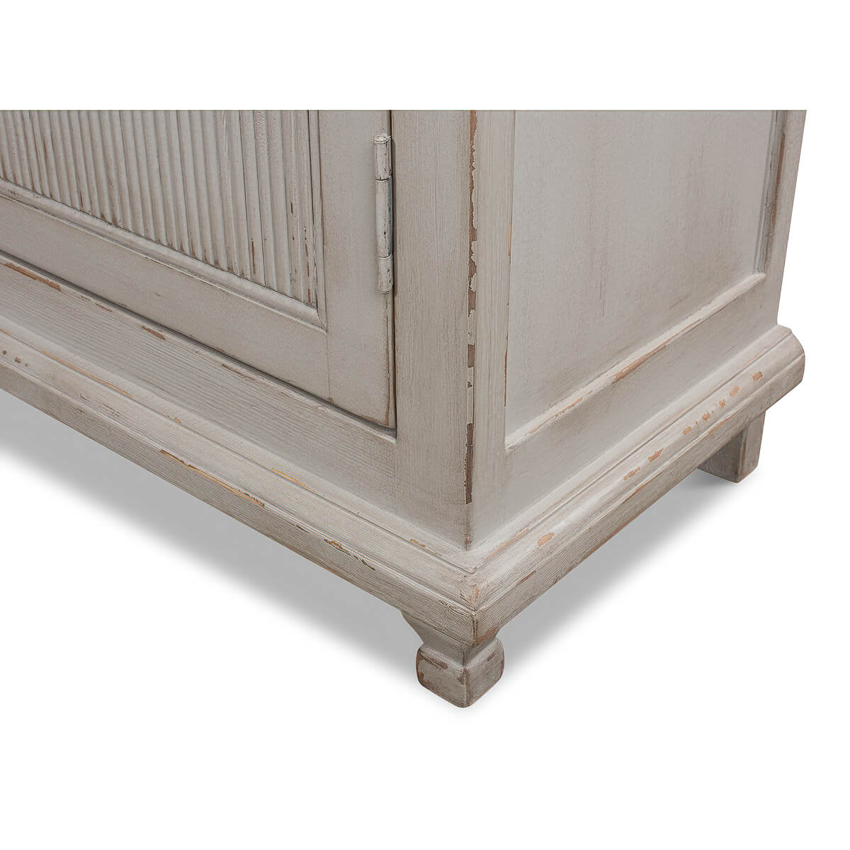 Bottom corner close-up of rustic grey painted bookcase