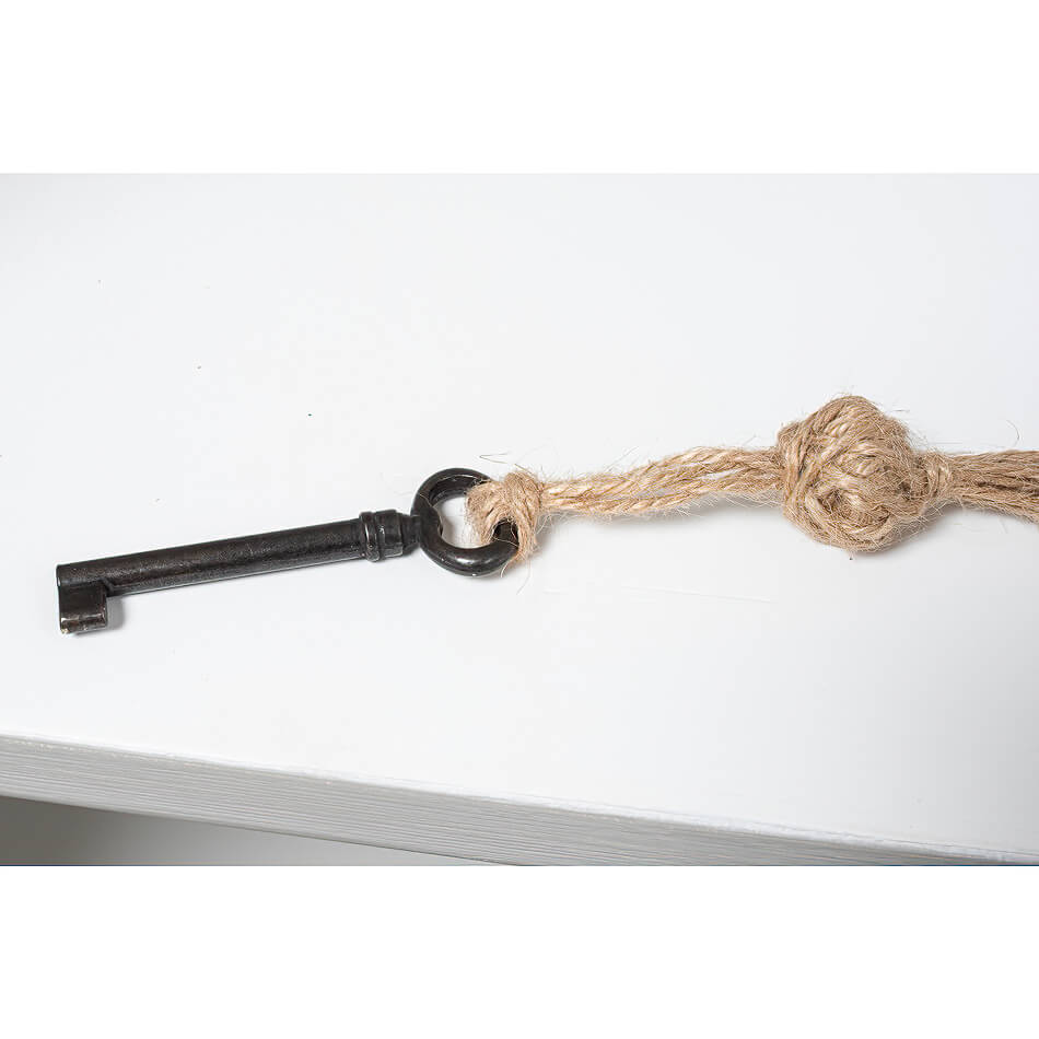 Vintage key with rope for rustic grey painted bookcase