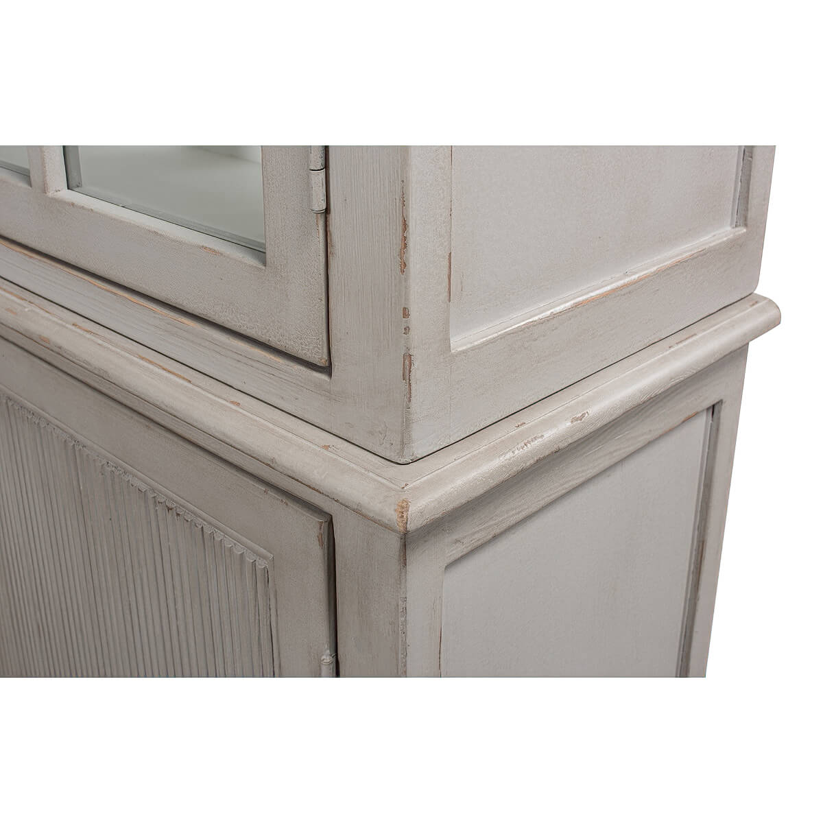 Close-up corner detail of rustic grey painted bookcase